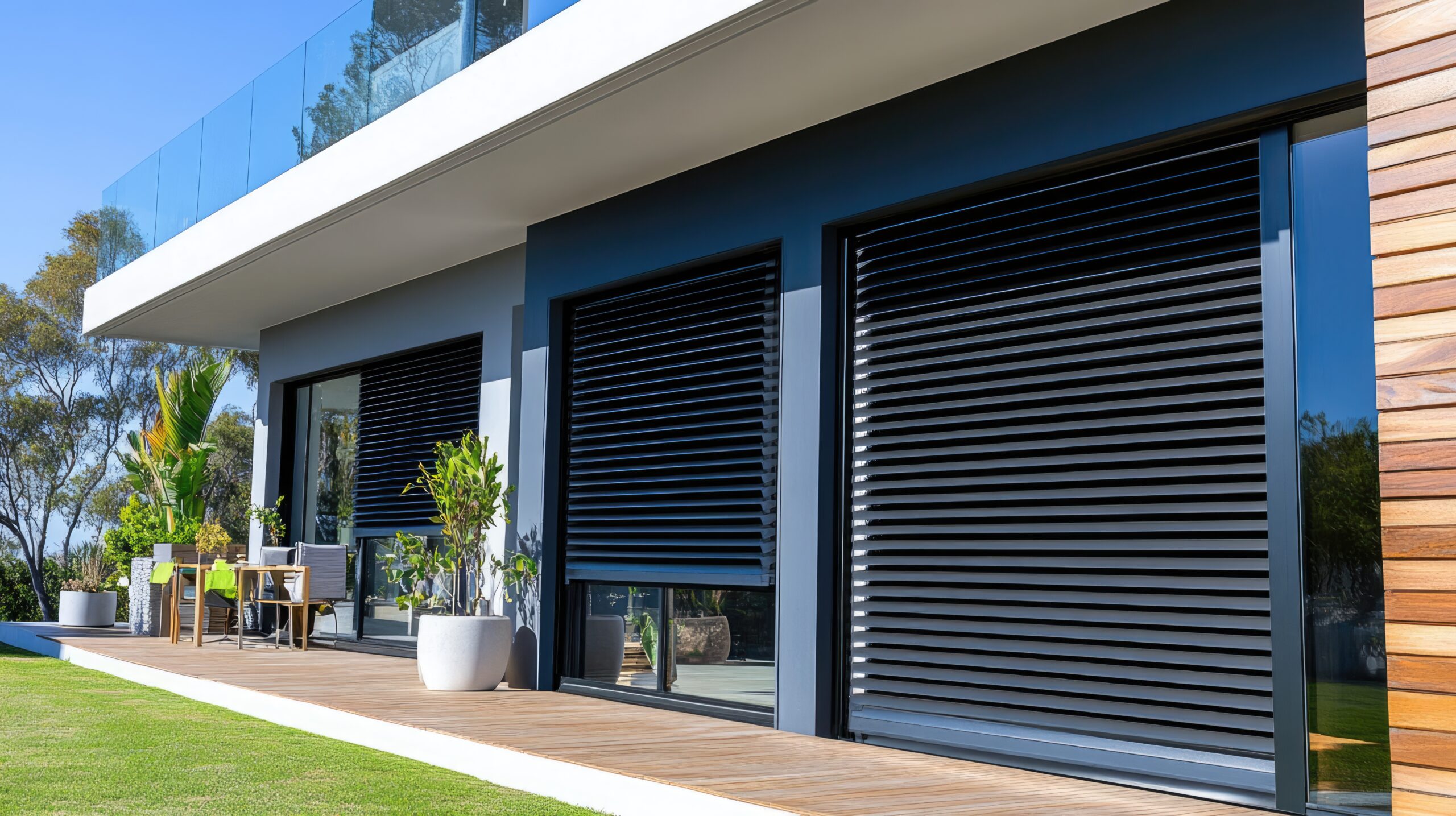 Modern Home with Black Blinds and Glass Railing